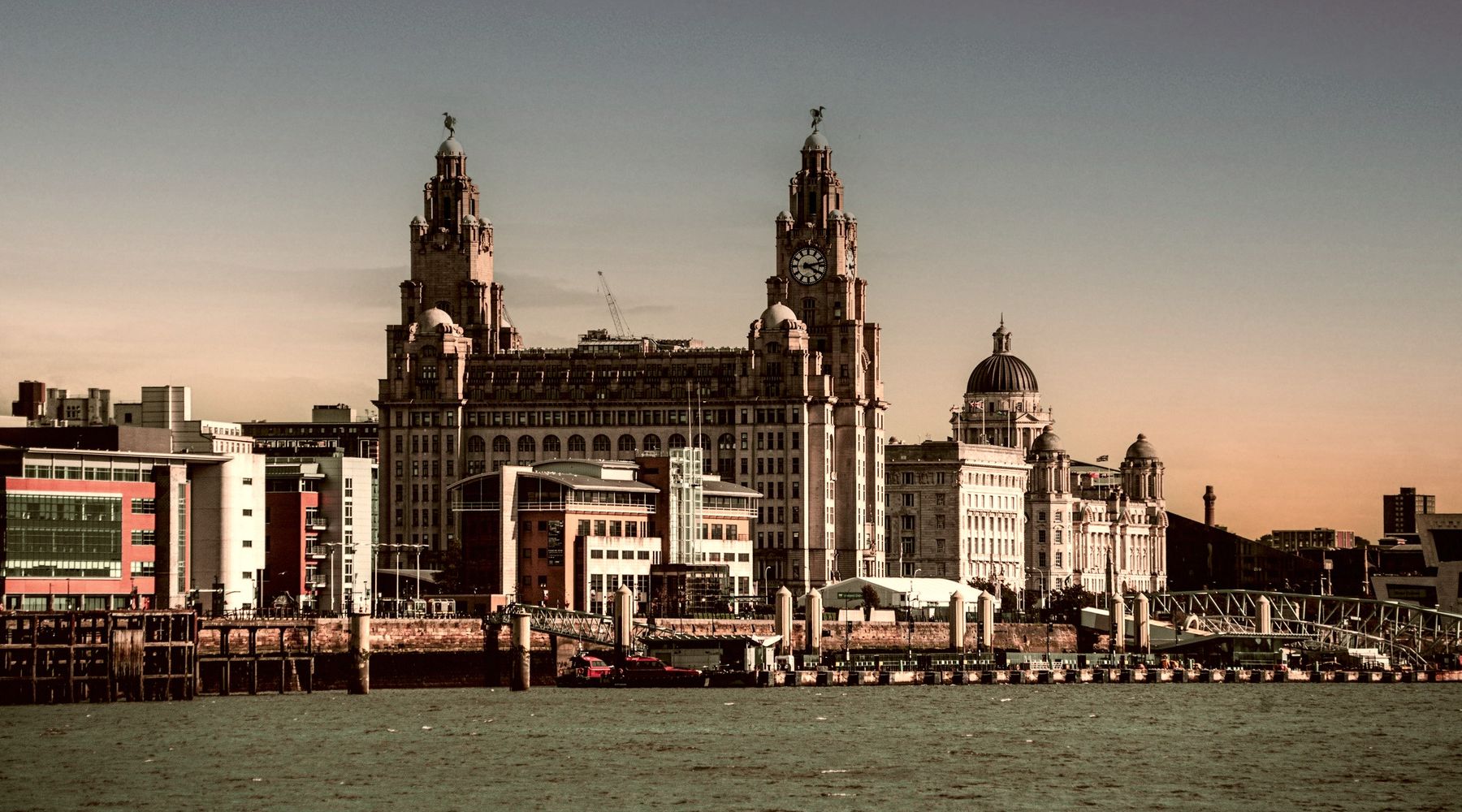 The Royal Liver Building and the Three Graces on the Liverpool waterfront, seen from the River Mersey